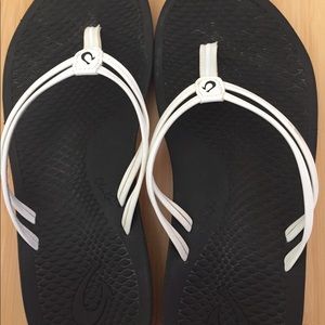 Olukai white, flip-flops.